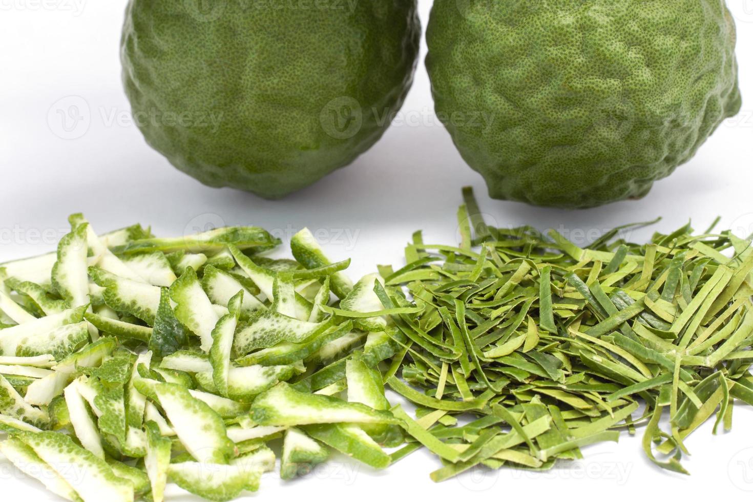Closeop slice Bergamot, Kaffir lime, Leech lime or Mauritius papeda fruit and leaf is a vegetable and herb of Thailand used as an ingredient in cooking and herbal medicine isolated on white background photo