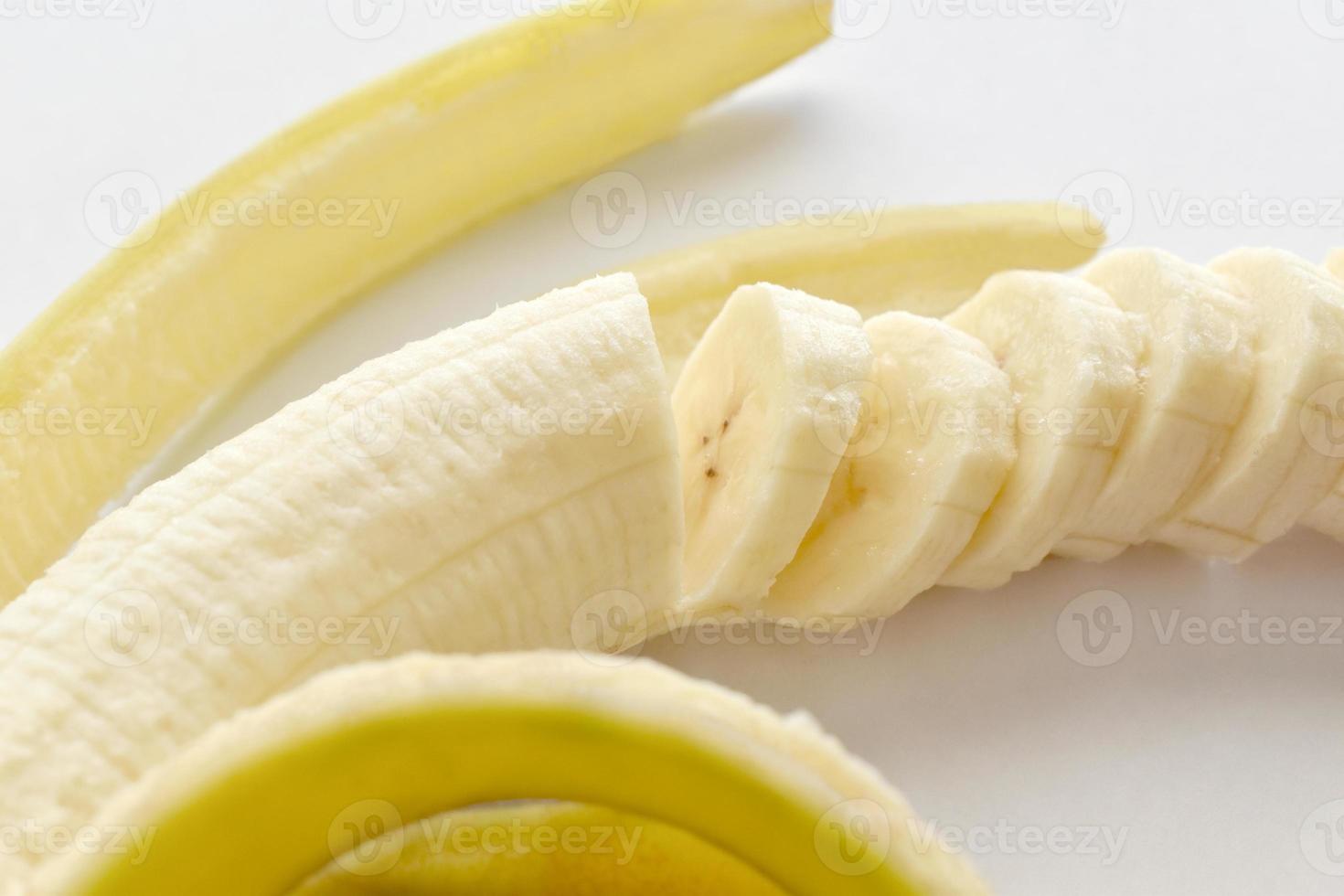 Banana slices on white background. Healthy and dietary food. photo