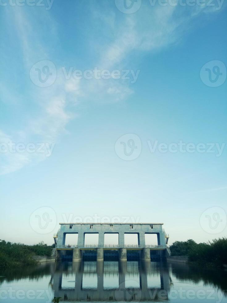 sluice in the morning against the background of a clear sky. the beauty of the river in the morning photo