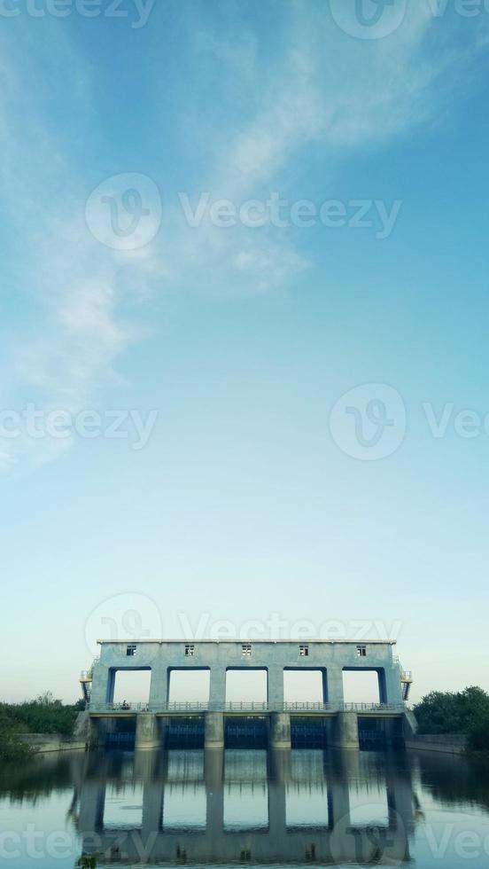 sluice in the morning against the background of a clear sky. the beauty of the river in the morning photo