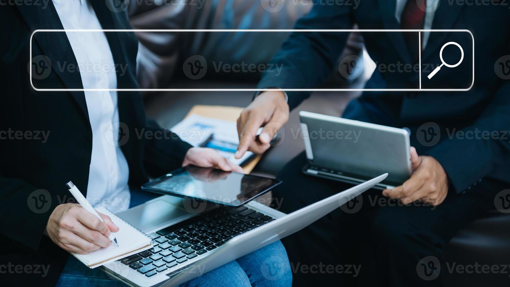 Searching Browsing Internet Data Information Networking Concept with blank search bar.man working with mobile phone and laptop computer VR icon in office photo