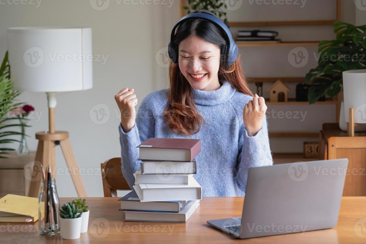 Relax, de-stress, vacation, have fun. Asian women take notes of their own past happily at home. photo