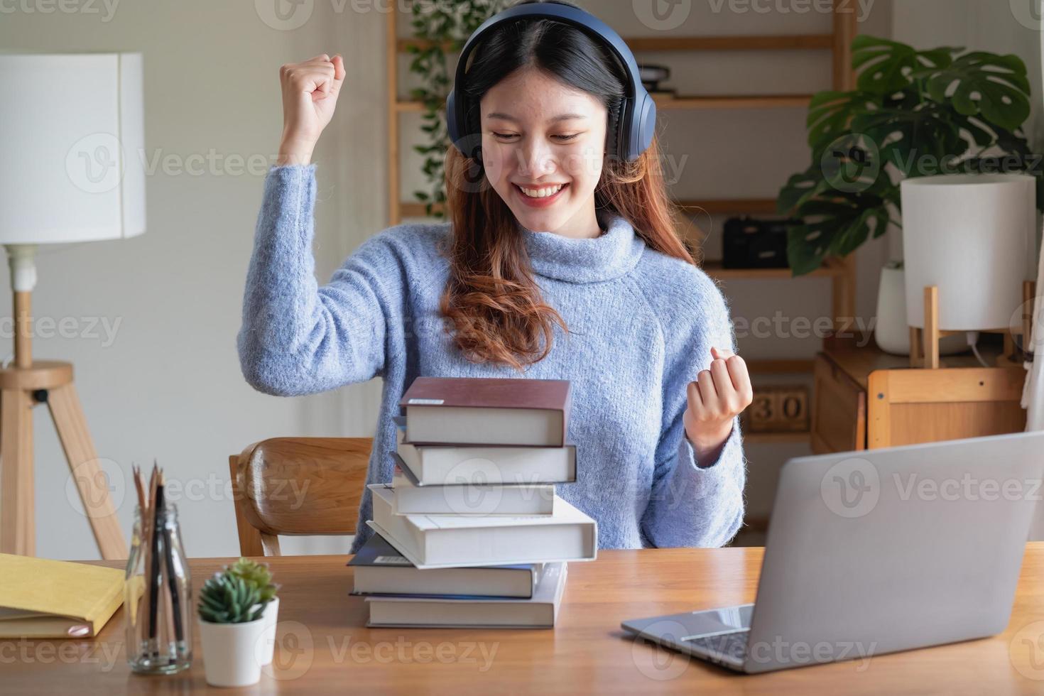 Relax, de-stress, vacation, have fun. Asian women take notes of their own past happily at home. photo