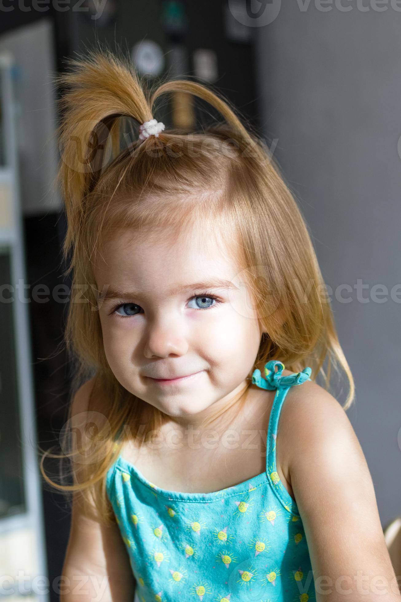 Adorable baby girl with blond hair and blue eyes in the morning in  sunlight. 12607304 Stock Photo at Vecteezy