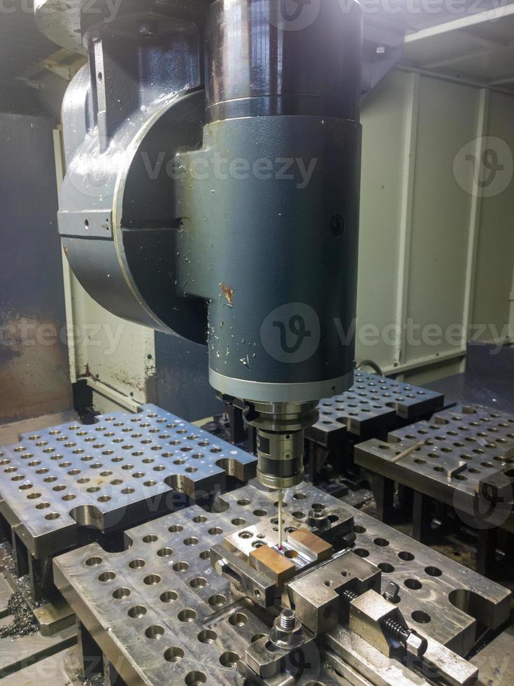 large cnc milling rotary head making measurements with contact probe in automatic mode photo