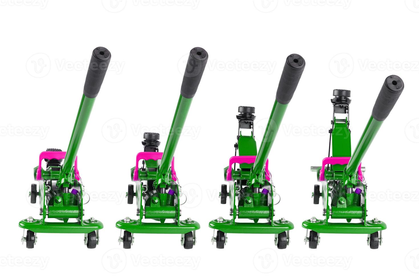 set of isolated green hydraulic car jacks on white background raised in different heights photo
