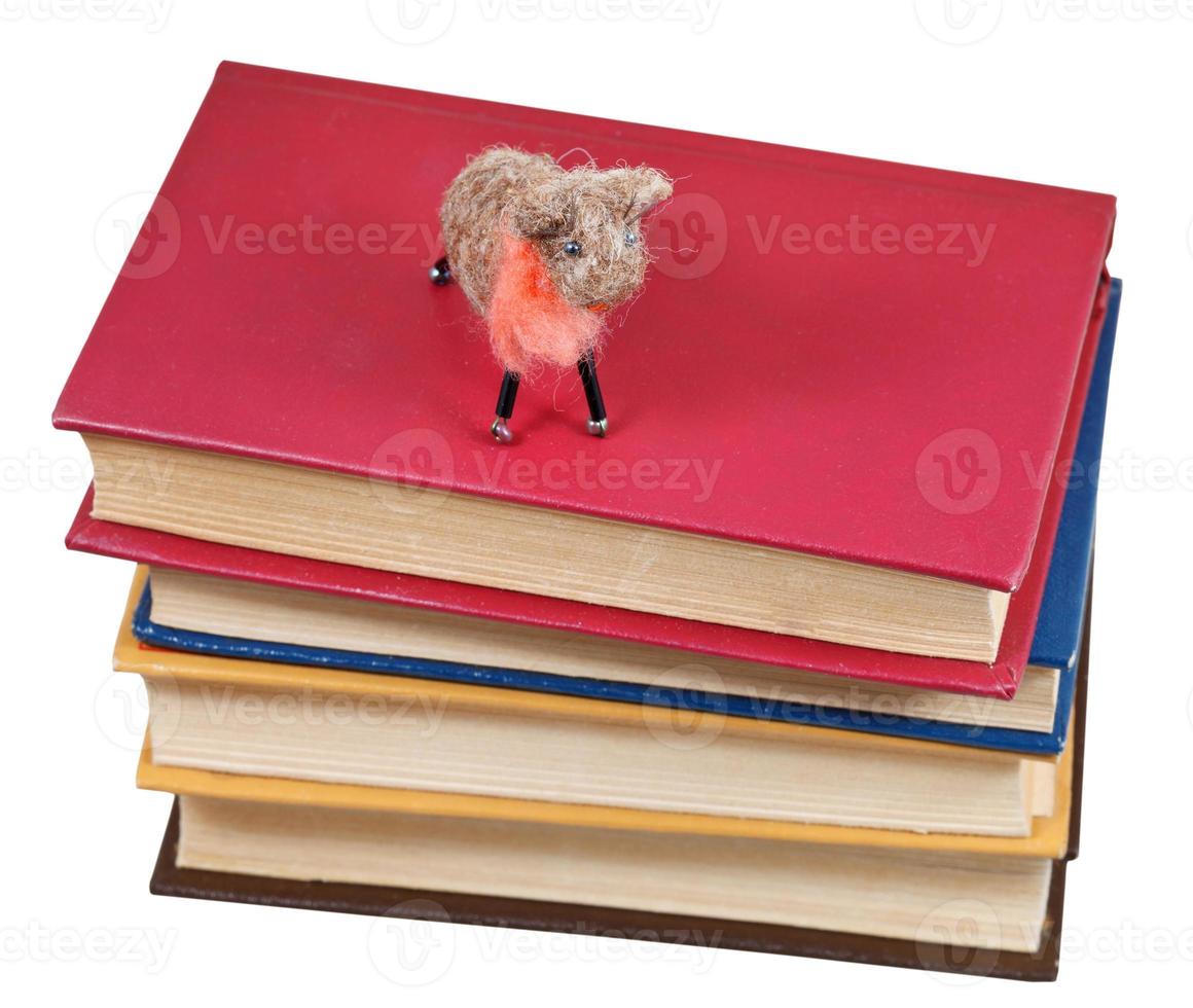 top view of felt soft toy sheep on books photo