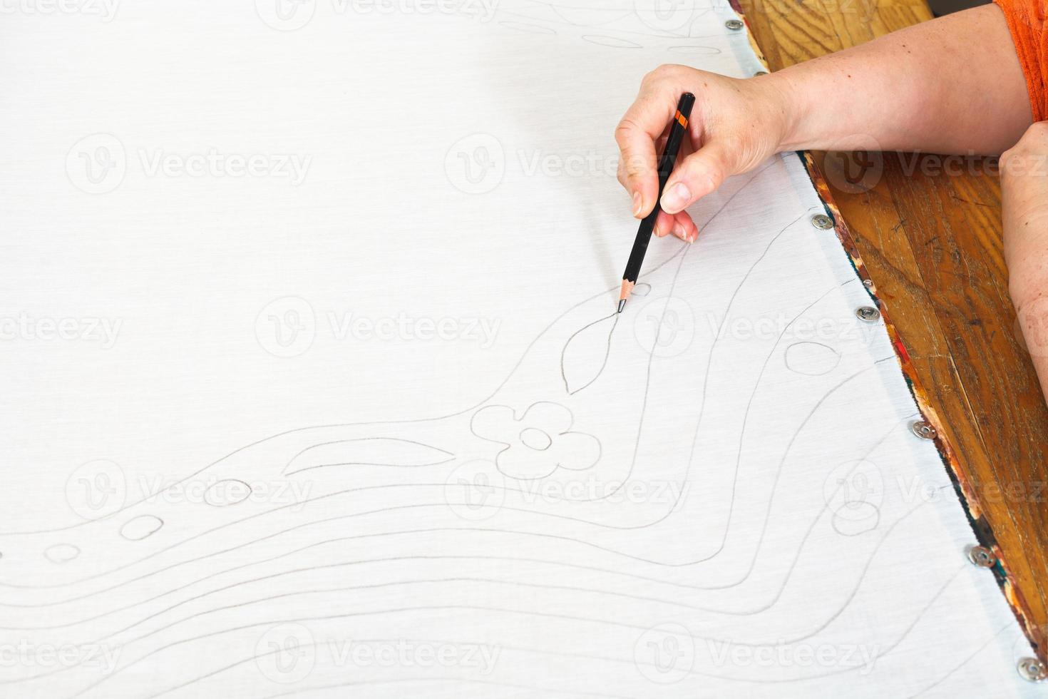 artist draws sketch on silk photo