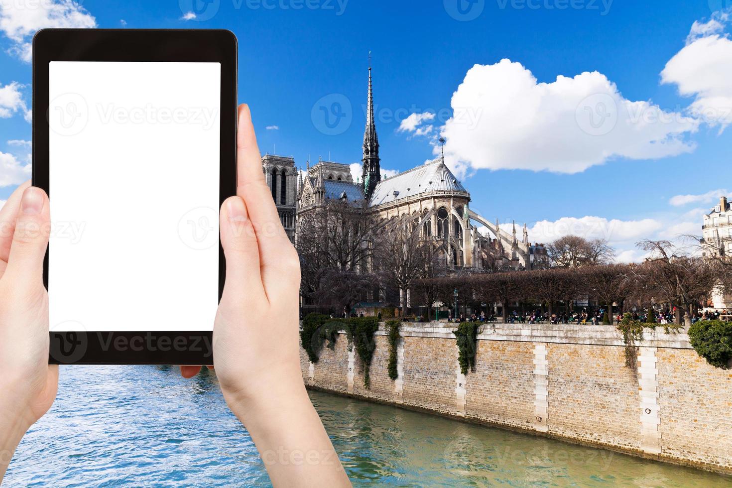 tourist photographs cathedral Notre Dame in Paris photo