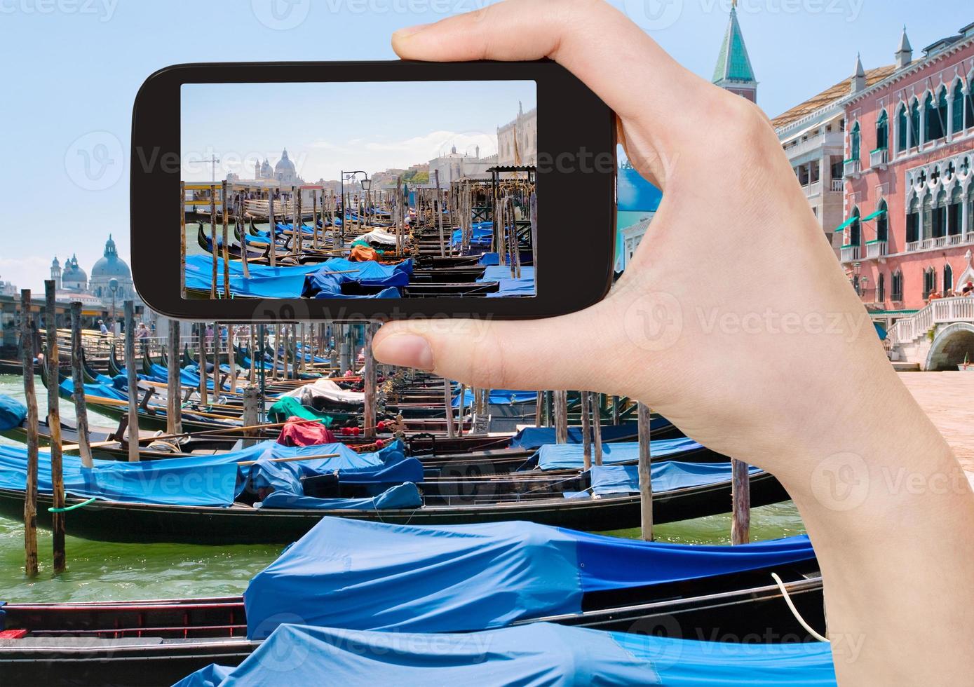 taking photo of gondolas near Piazza San Marco