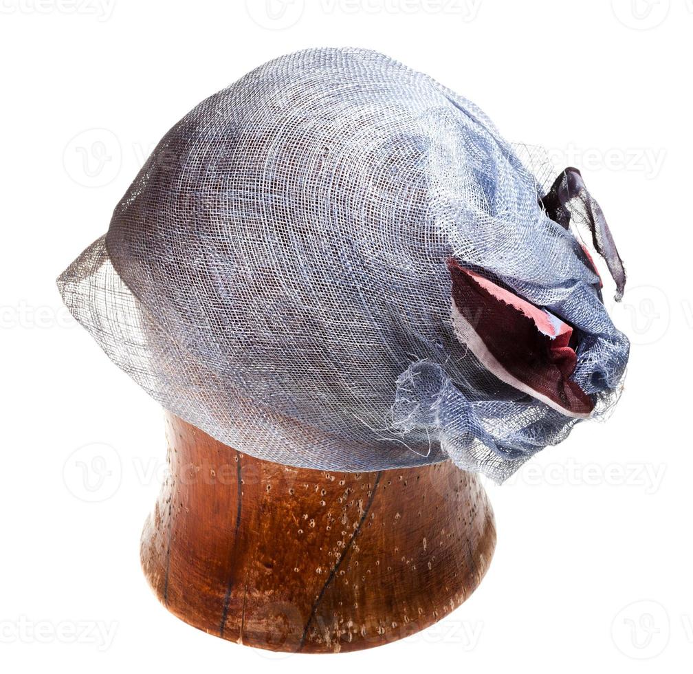 straw hat bonnet on wooden block photo