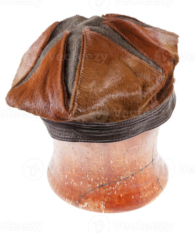brown fur beret hat on wooden block 12609862 Stock Photo at Vecteezy