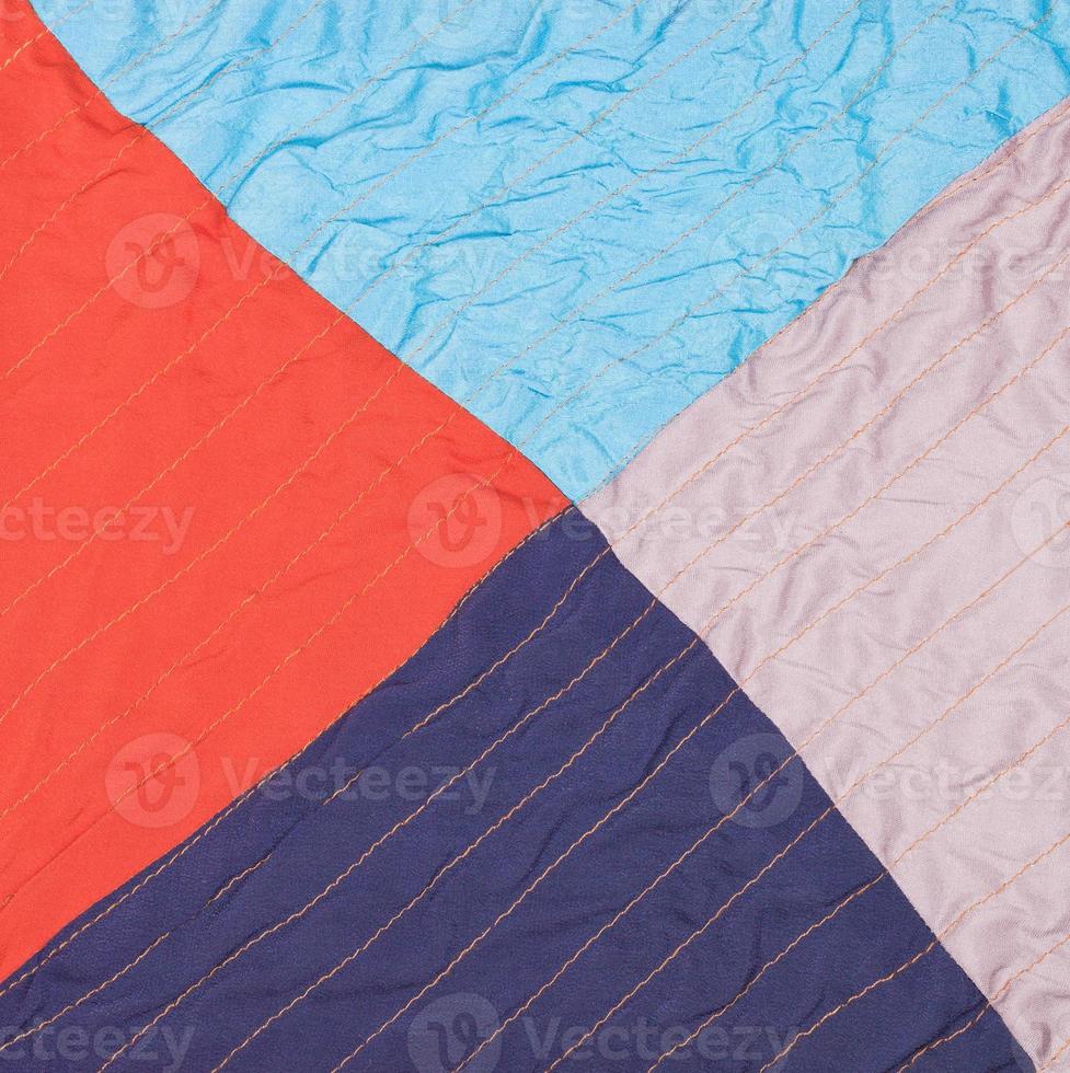 square from triangles in stitched patchwork quilt photo