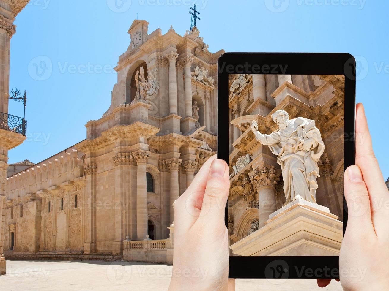 tourist taking photo of Apostle statue in Syracuse