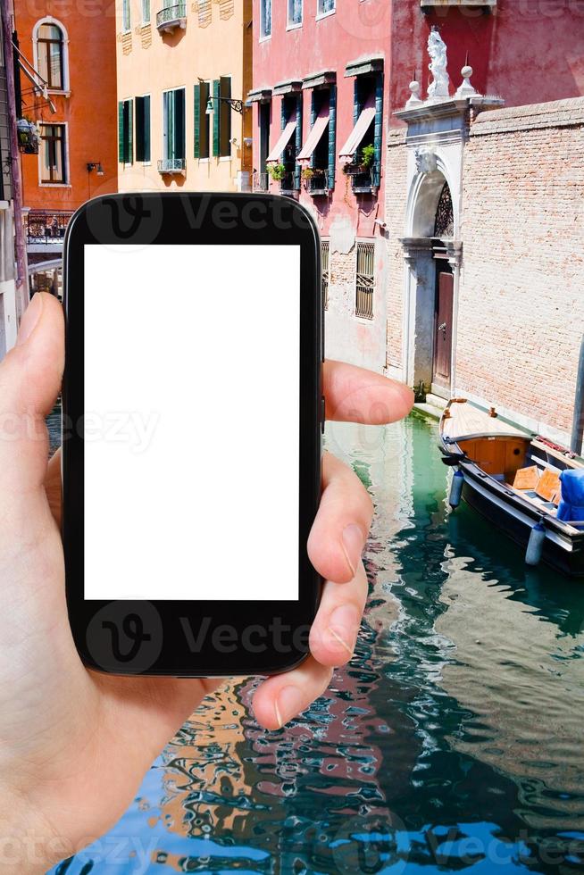tourist photographs of canal, boats in Venice photo