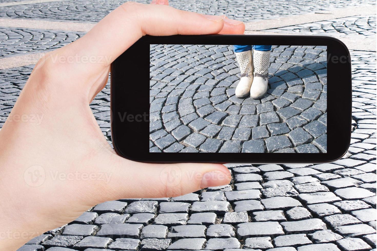 tourist photographs pavement of Palace Square photo