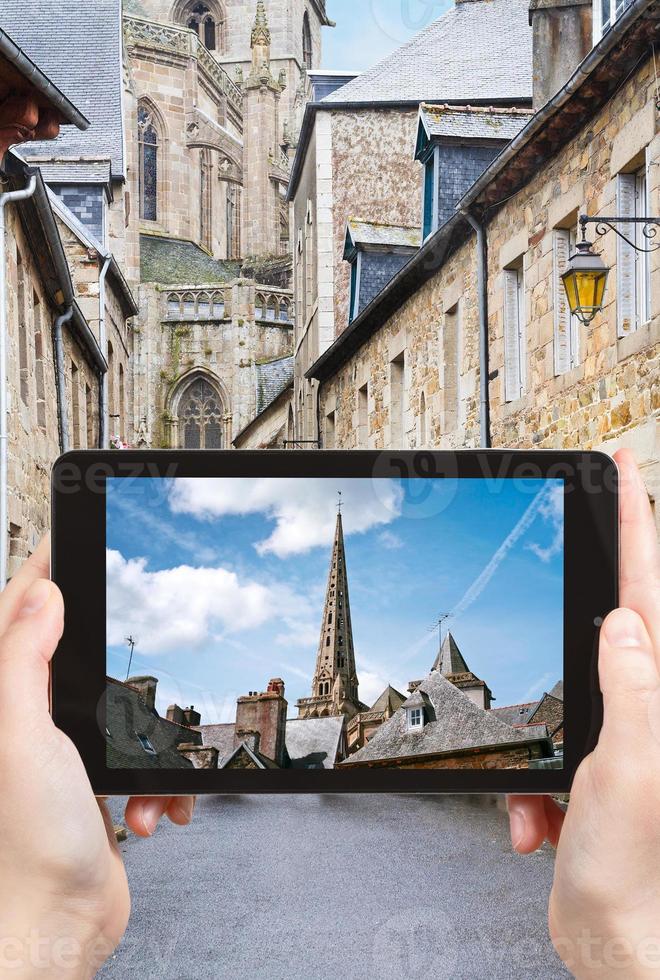 tourist taking photo of Cathedral in Treguier