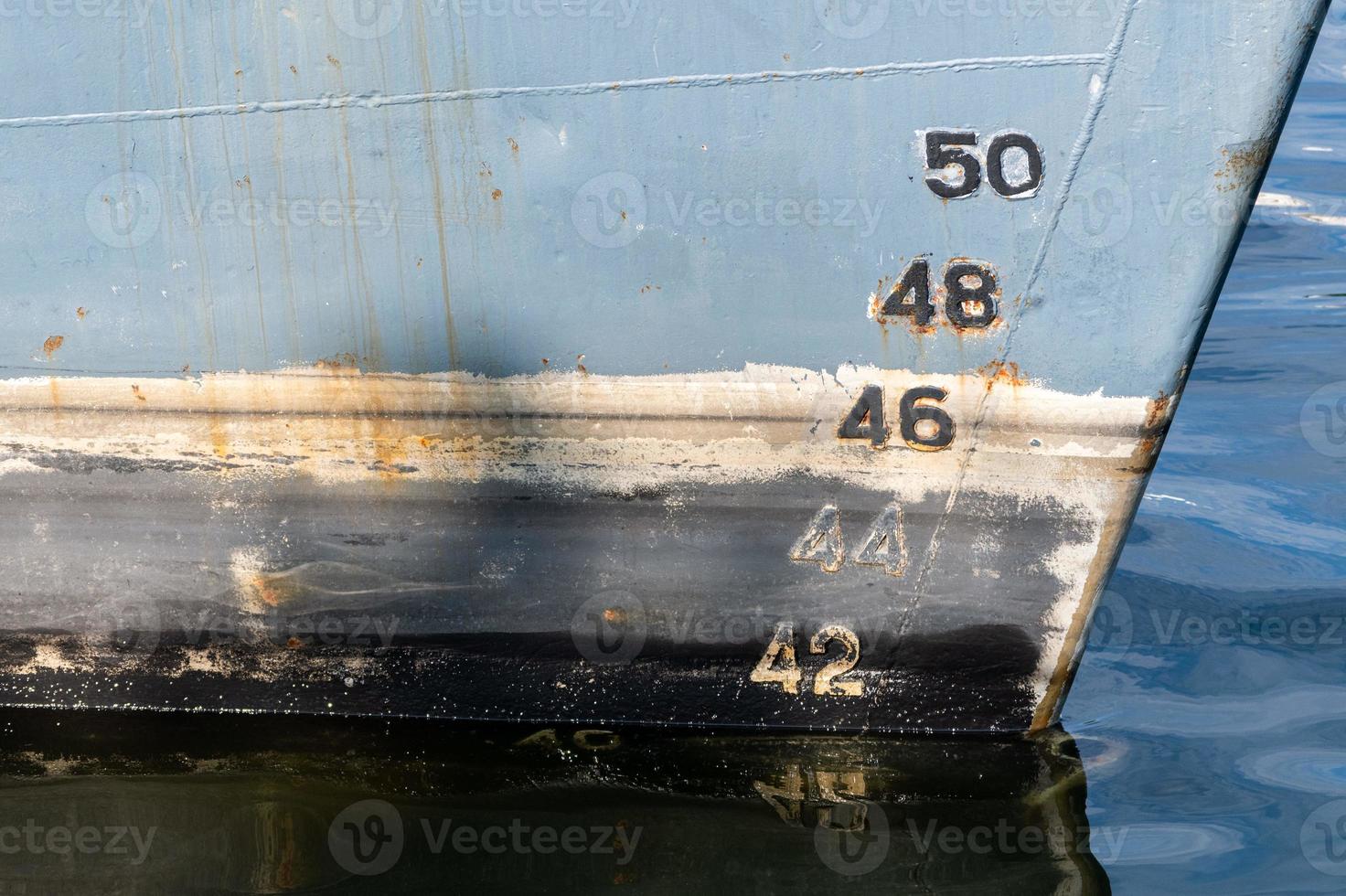 Old ship draft on hull, scale numbering. Distance between waterline and bottom keel. photo
