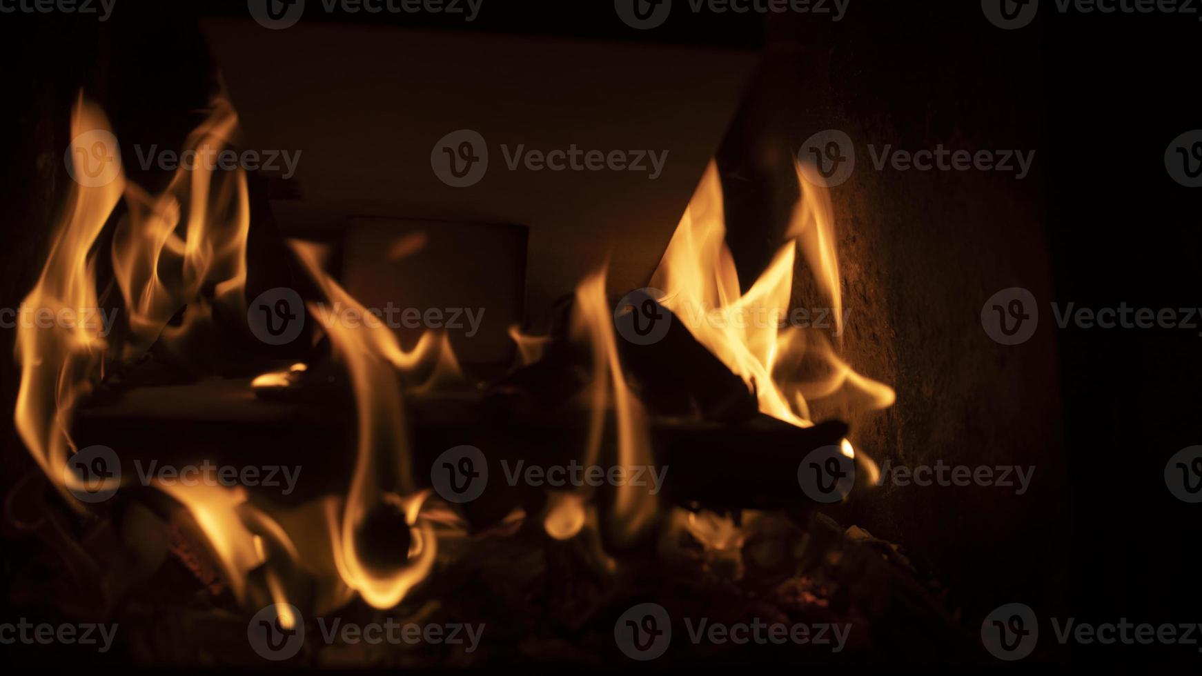 Firewood burning in fire. Flame in furnace. Hearth in house. Fireplace details. 12612262 Stock