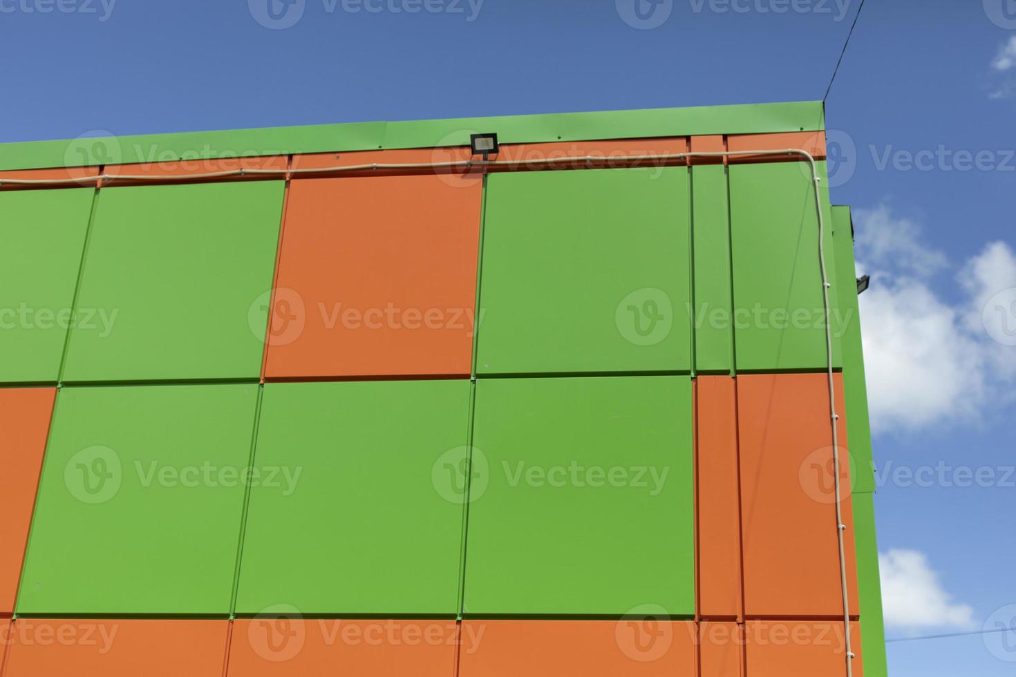 Corner of building. Modern architecture. Green and orange color in exterior  of building. 12612383 Stock Photo at Vecteezy