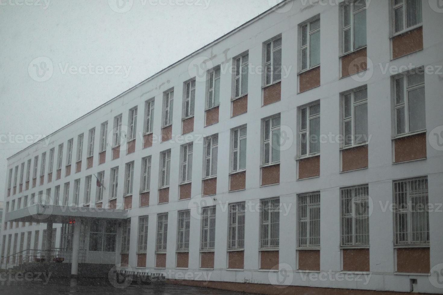School in Russia. Building is on rainy day. photo