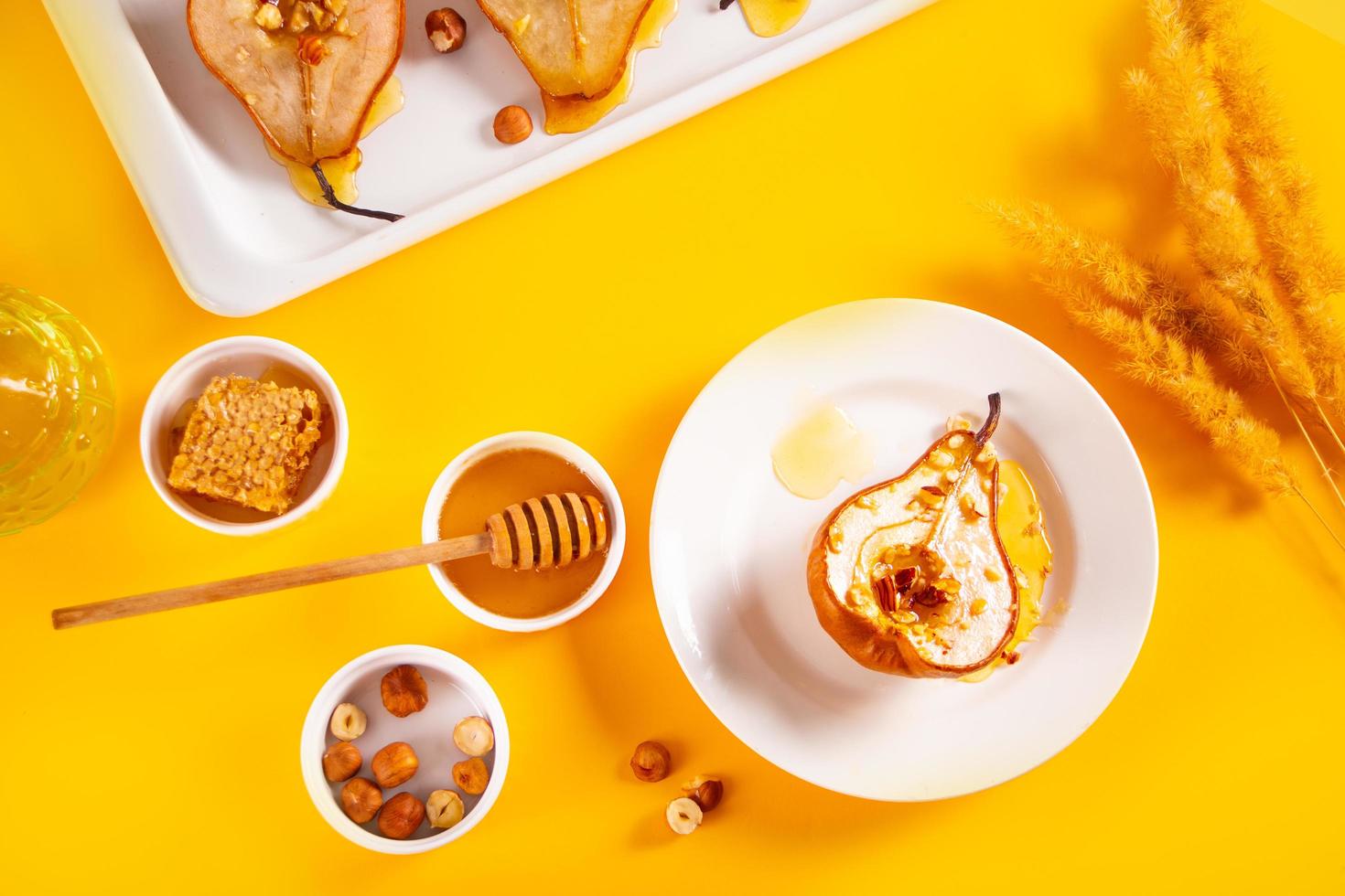 Honey or marple syrup roast pears with walnuts. Vegetarian diet health delicious dessert. photo