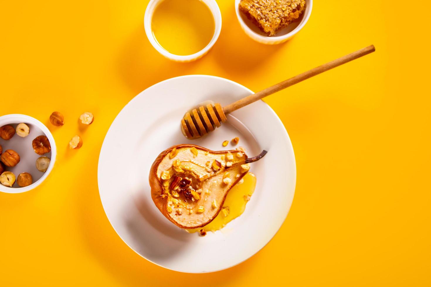 Honey or marple syrup roast pears with walnuts. Vegetarian diet health delicious dessert. photo