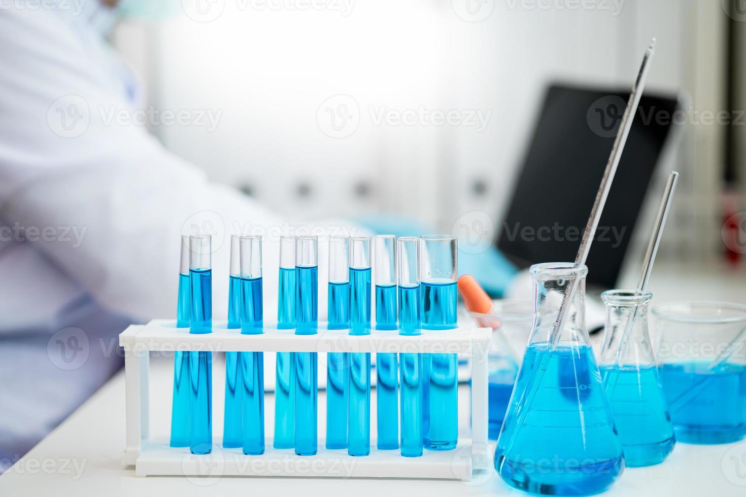 Medical Research Laboratory. Male scientist analyzes advanced science lab data for medicine. Biotechnology. Microbiology Development. Researchers in the lab wear sterile gloves and lab. photo