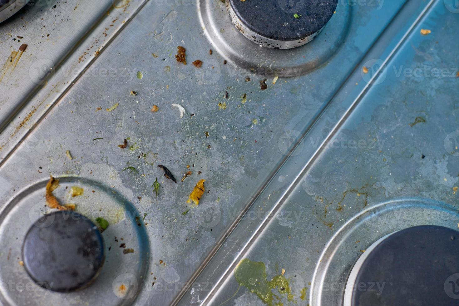 Dirty stove top with oil splatters, fat stains and food leftovers photo