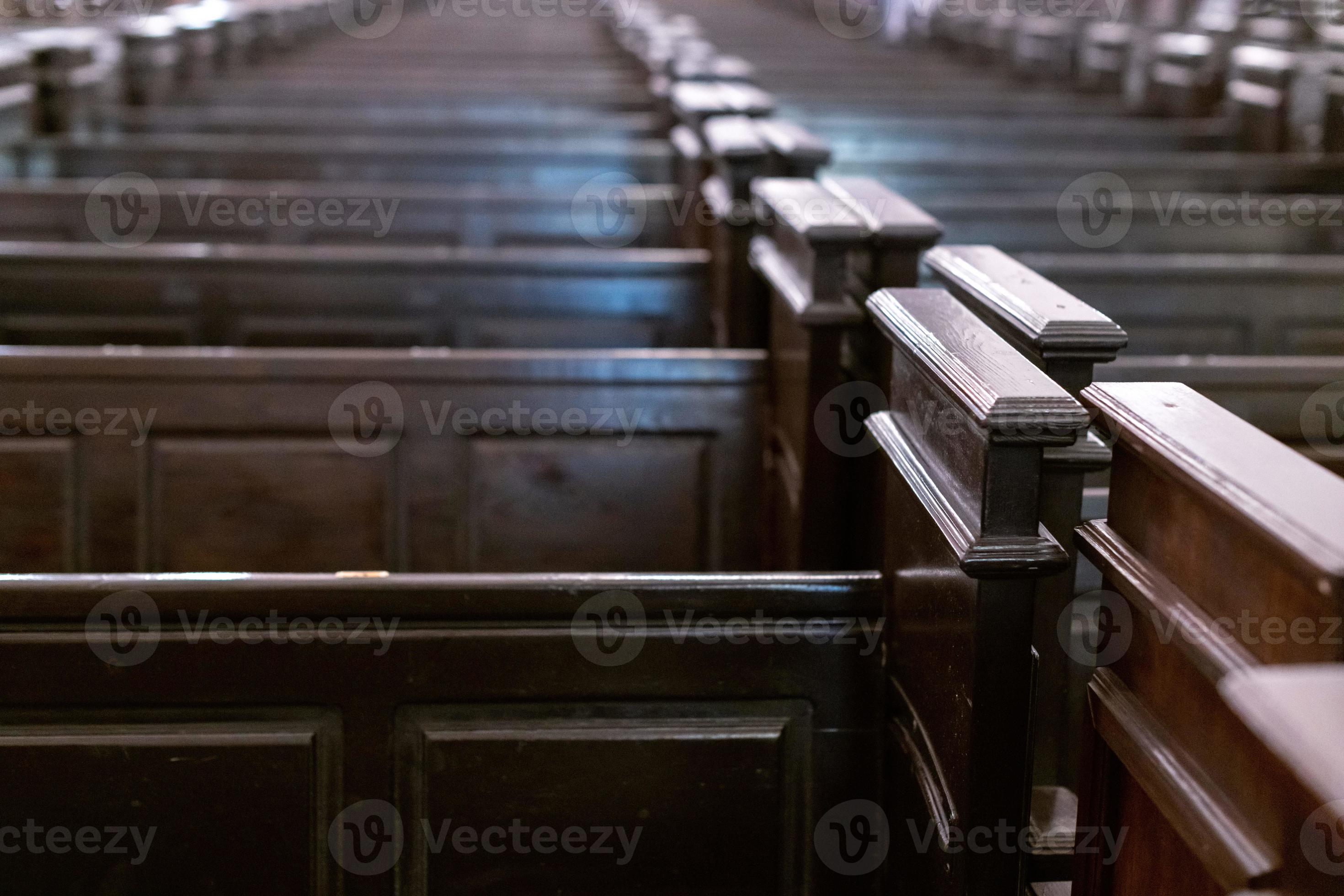 Cathedral pews. Rows of benches in christian church. Heavy solid