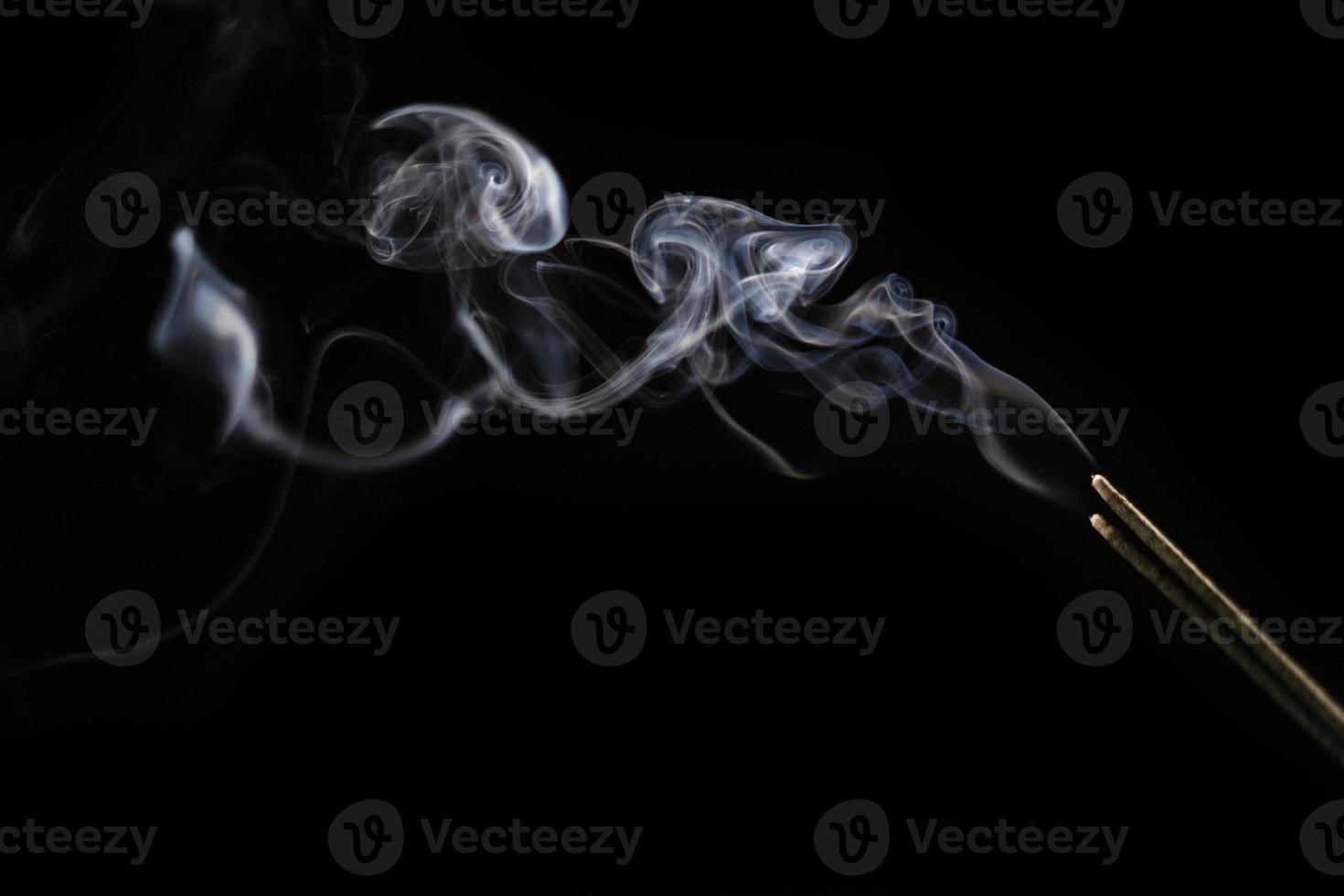 White smoke on black background for layer overlay effect. A realistic smoke or fog effect for photo and video manipulation effect and mystery design theme