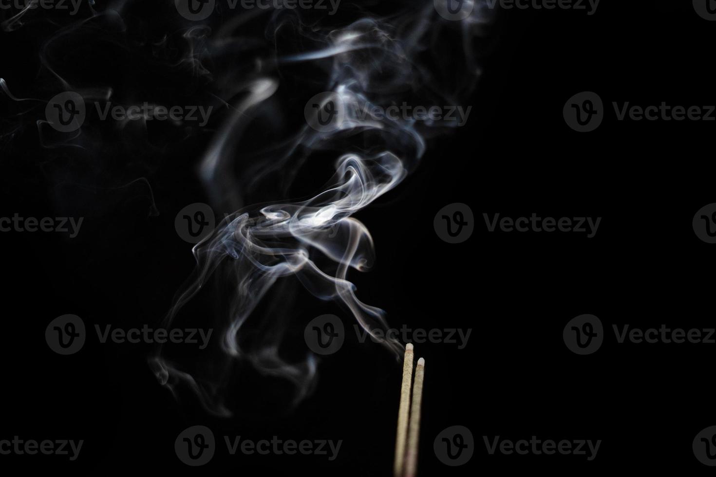 White smoke on black background for layer overlay effect. A realistic smoke or fog effect for photo and video manipulation effect and mystery design theme