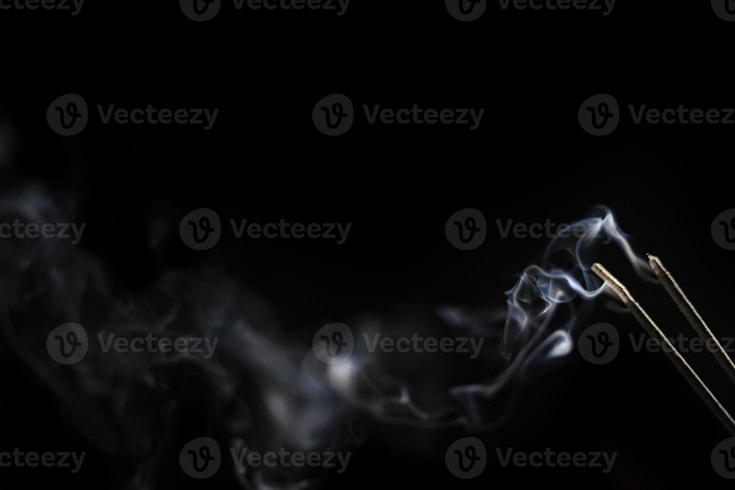 White smoke on black background for layer overlay effect. A realistic smoke or fog effect for photo and video manipulation effect and mystery design theme