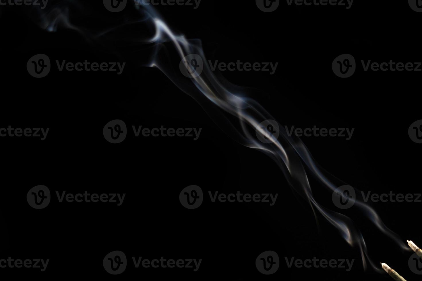 White smoke on black background for layer overlay effect. A realistic smoke or fog effect for photo and video manipulation effect and mystery design theme