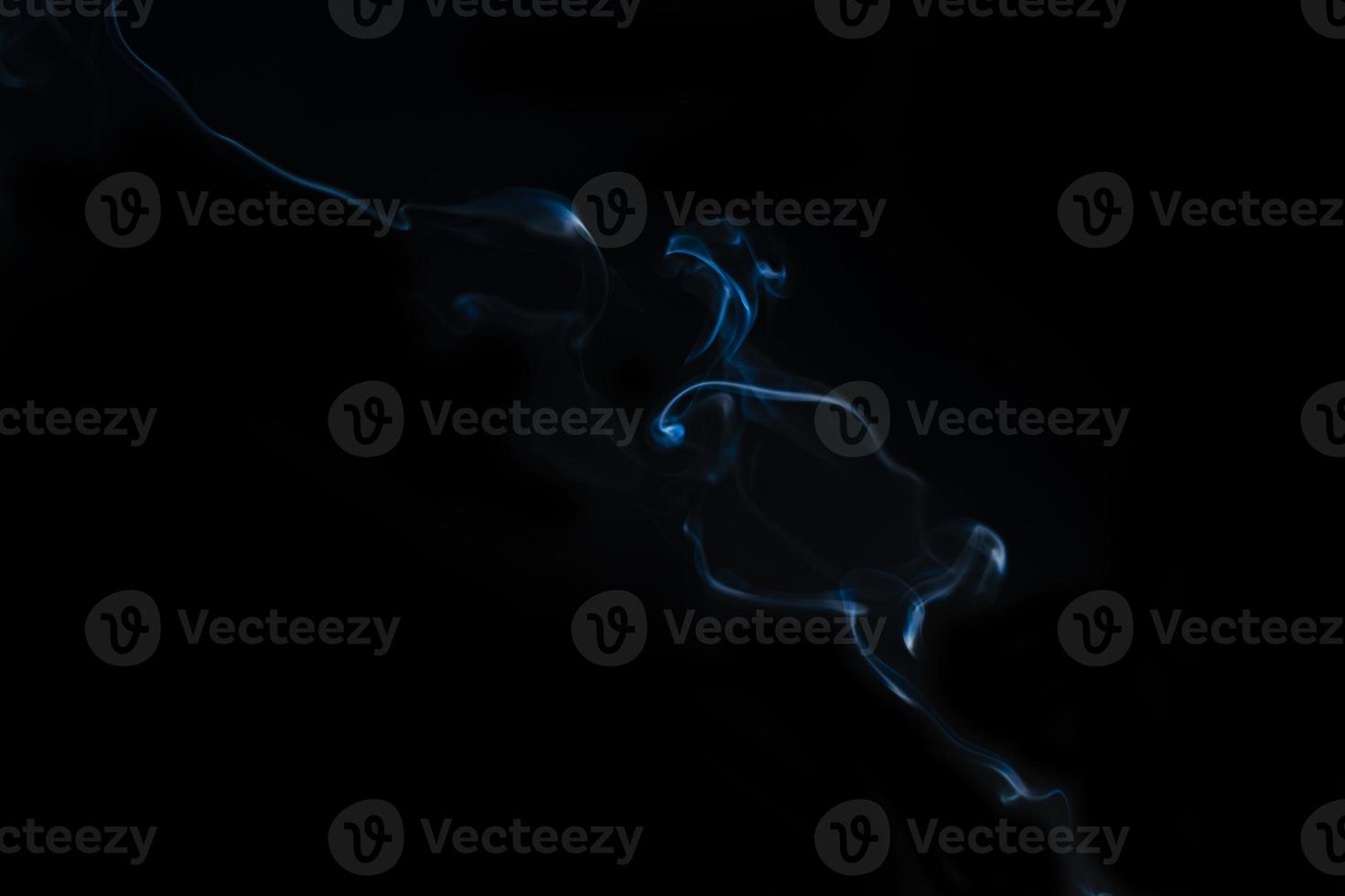 White smoke on black background for layer overlay effect. A realistic smoke or fog effect for photo and video manipulation effect and mystery design theme