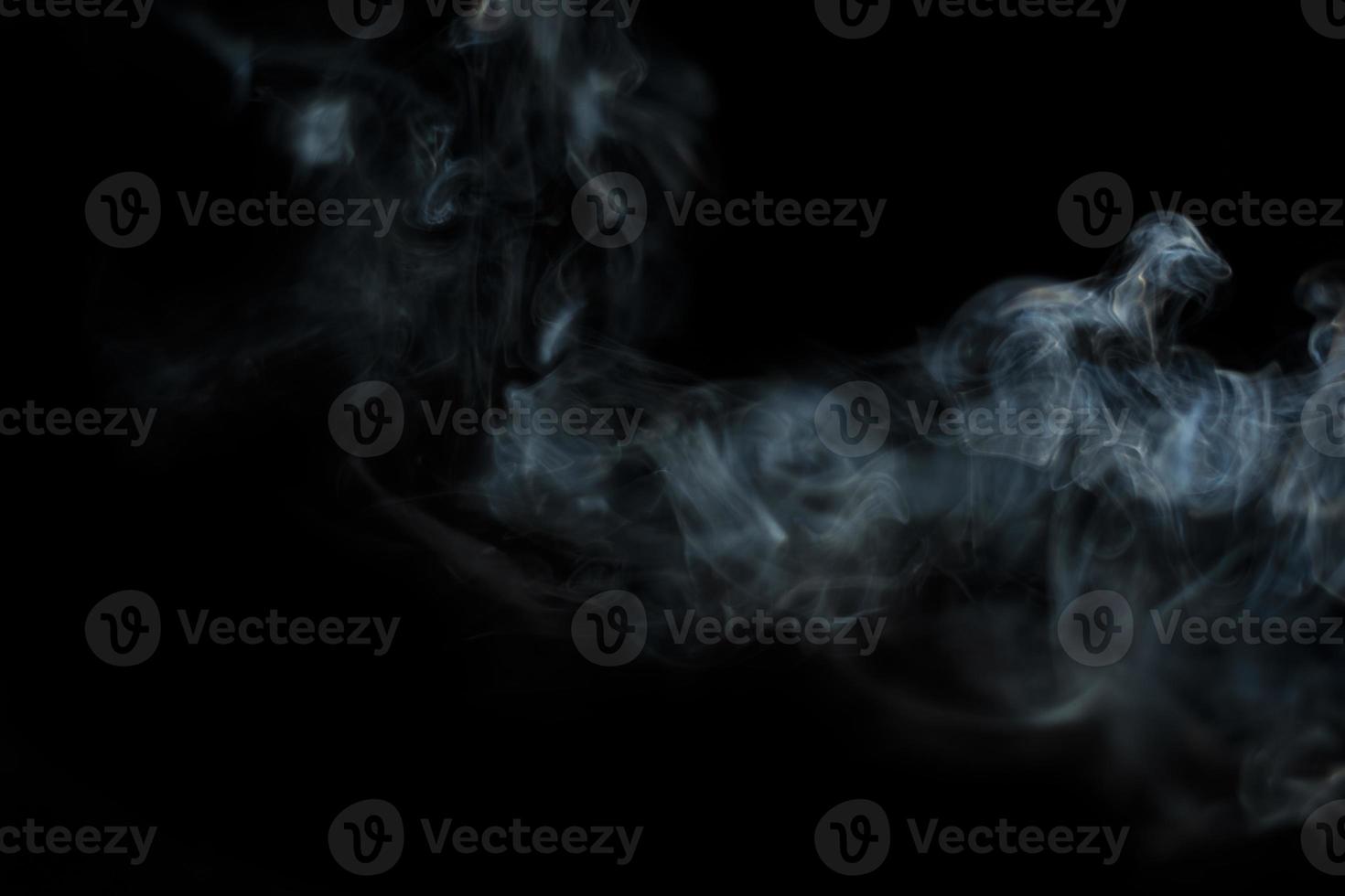 White smoke on black background for layer overlay effect. A realistic smoke or fog effect for photo and video manipulation effect and mystery design theme