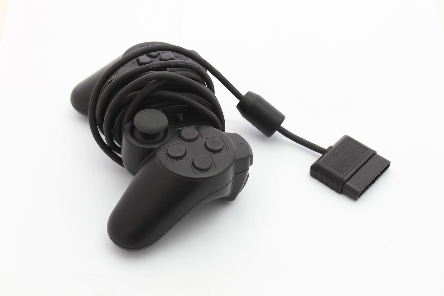 black joystick isolated on the white background photo