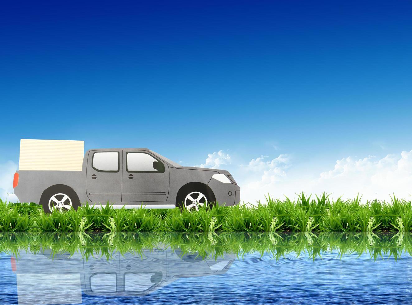 paper car on the grass field photo