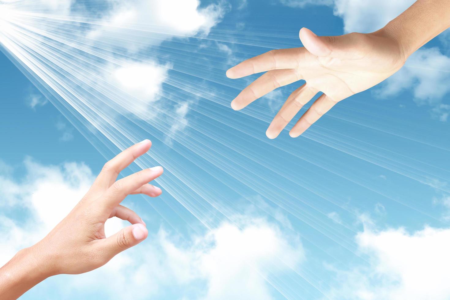 abstract concept hand towards sky, ray of light photo