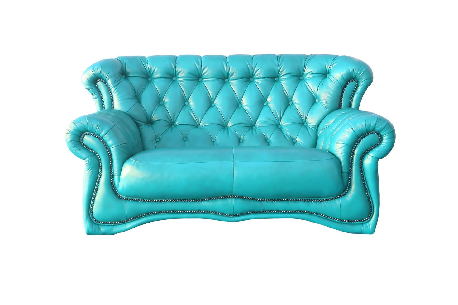 Sillón de cuero azul de lujo aislado sobre fondo blanco. foto