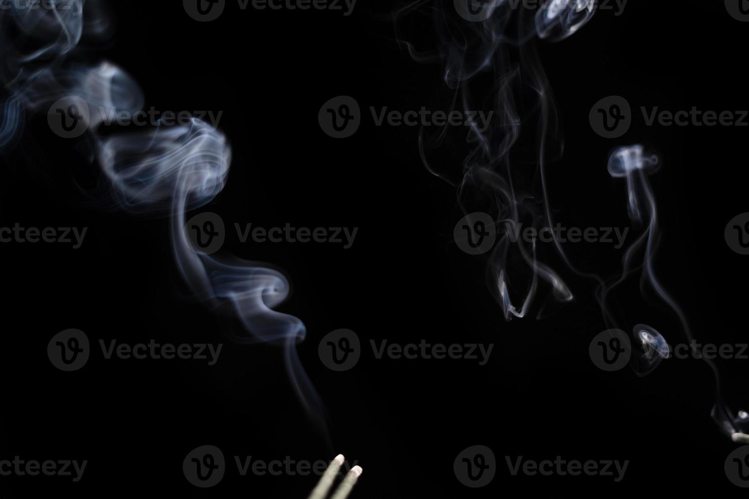 White smoke on black background for layer overlay effect. A realistic smoke or fog effect for photo and video manipulation effect and mystery design theme