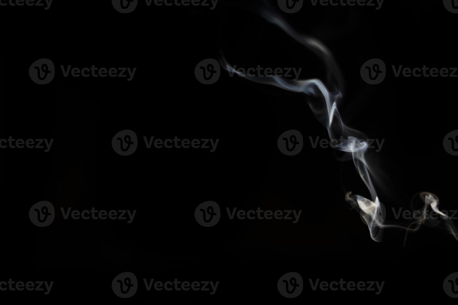 White smoke on black background for layer overlay effect. A realistic smoke or fog effect for photo and video manipulation effect and mystery design theme