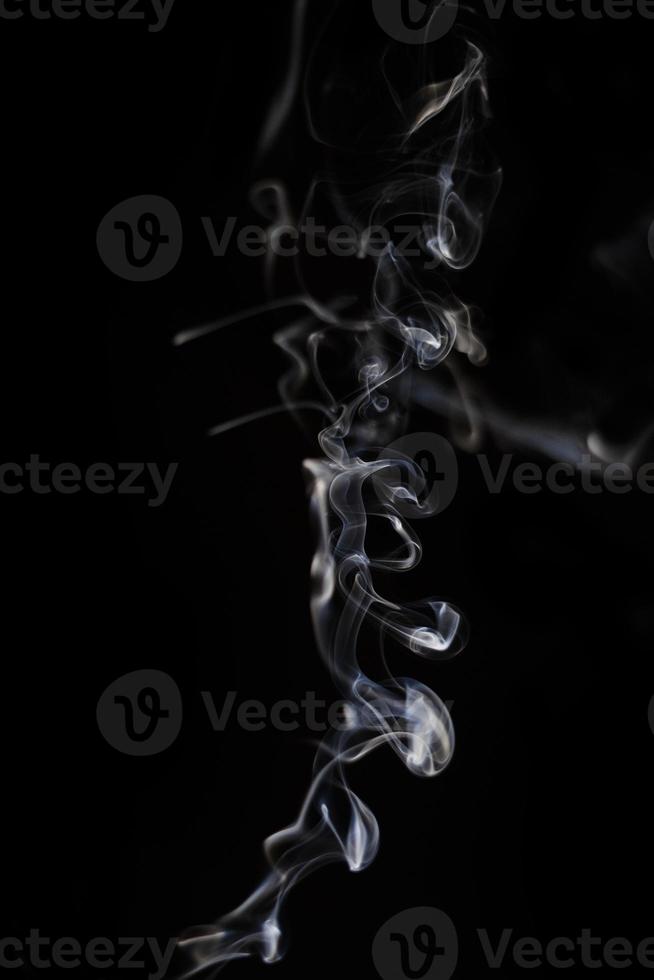 White smoke on black background for layer overlay effect. A realistic smoke or fog effect for photo and video manipulation effect and mystery design theme