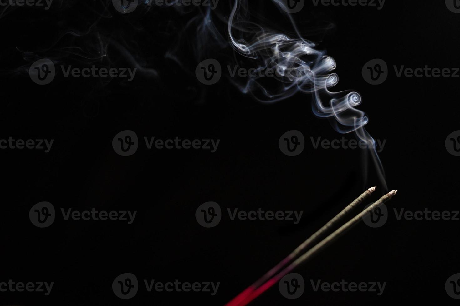 White smoke on black background for layer overlay effect. A realistic smoke or fog effect for photo and video manipulation effect and mystery design theme