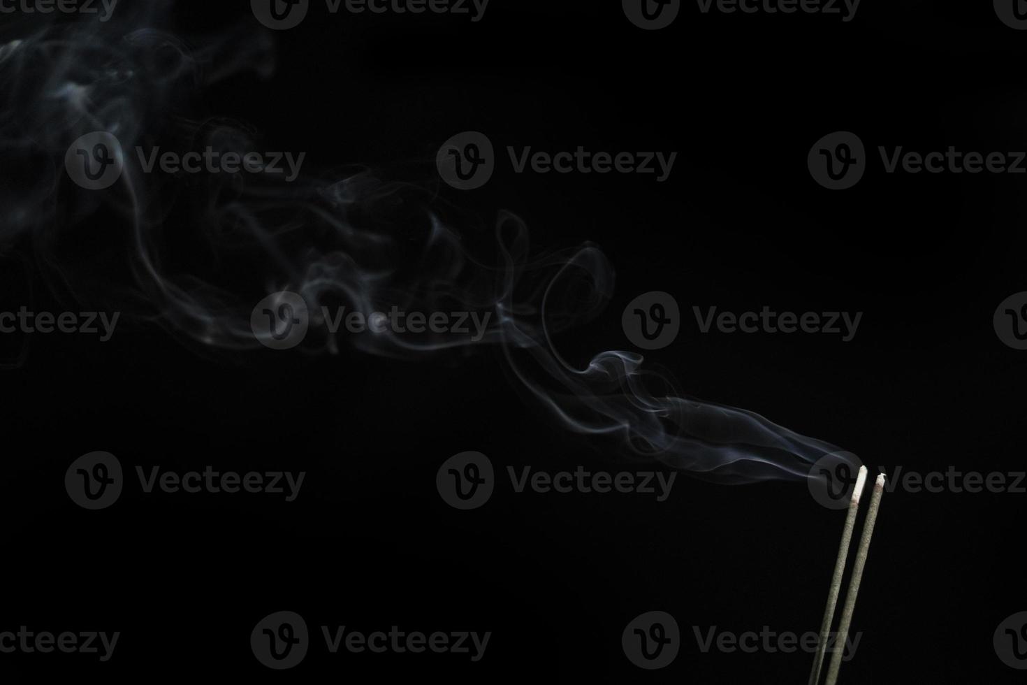White smoke on black background for layer overlay effect. A realistic smoke or fog effect for photo and video manipulation effect and mystery design theme