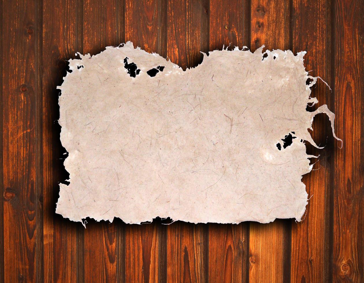 old paper on brown wood texture with natural patterns photo