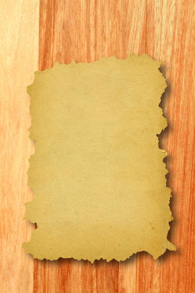 Old paper on the wood background photo