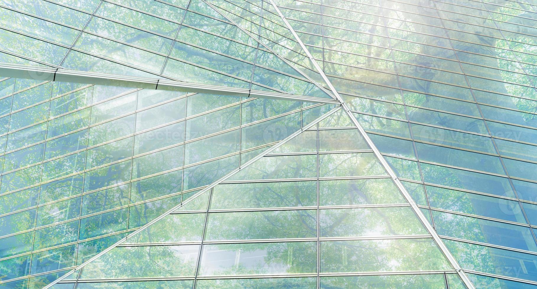 Sustainble green building. Eco-friendly building. Sustainable glass office building with tree for reducing carbon dioxide. Office with green environment. Corporate building reduce CO2. Safety glass. photo