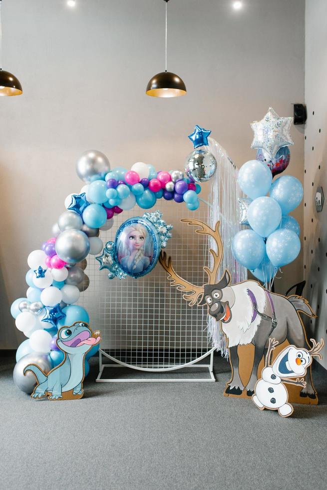 San Francisco, USA. May 2021. Festive balloons in blue and silver colors for your birthday. Frozen Heart style photo zone decor