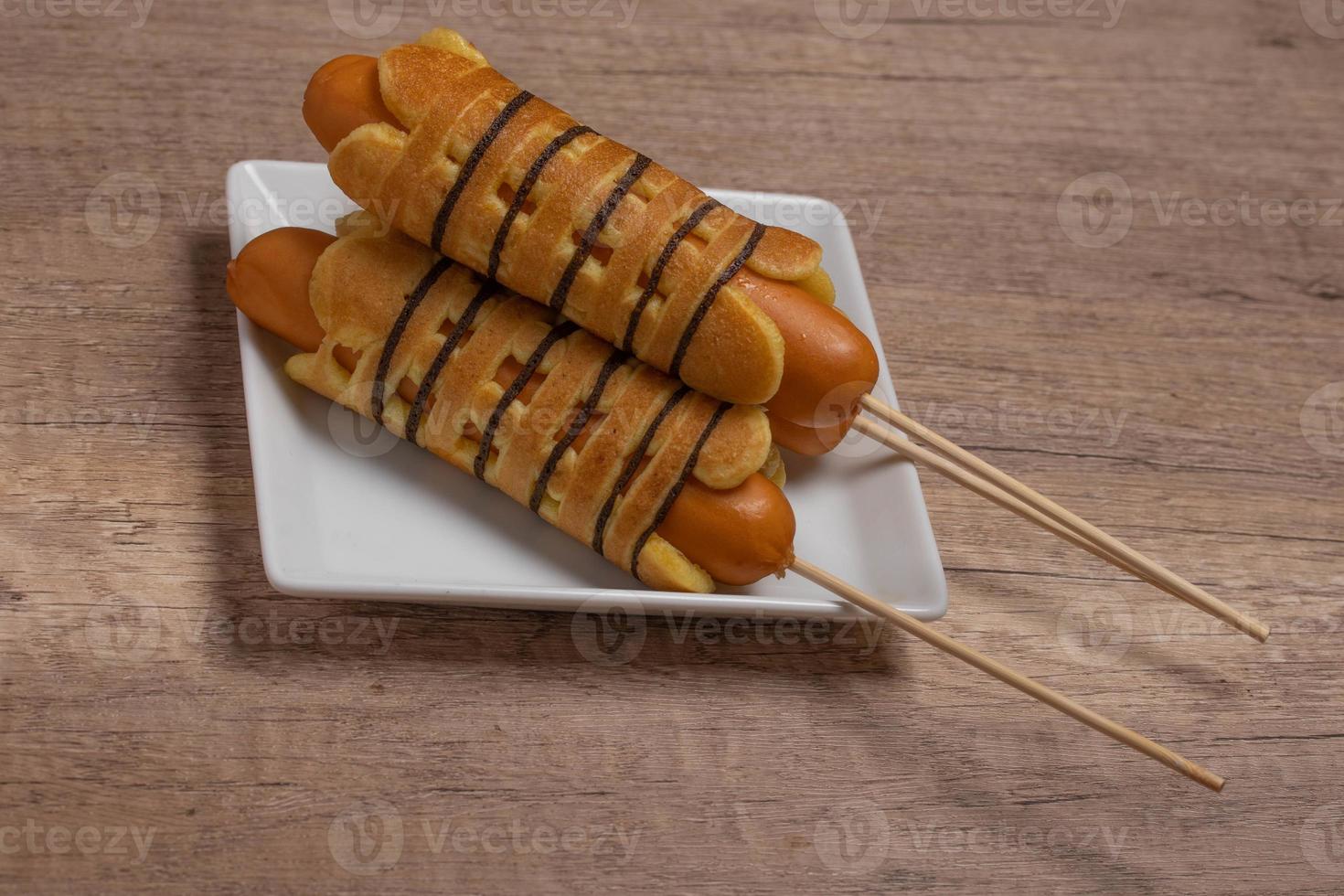 Breakfast sausage wrapped pancakes in a plate photo